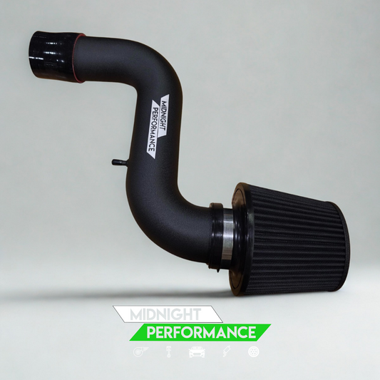 Black automotive air intake system with 'Midnight Performance' branding on a gray background